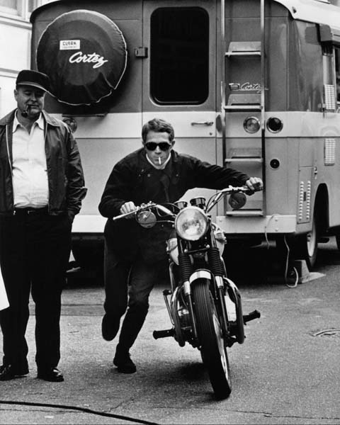 old school man walking with motorcycle